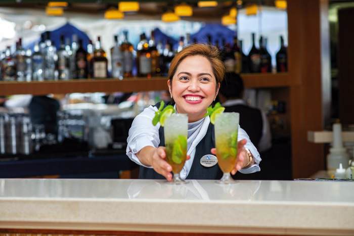 Fred. Olsen Cruise Lines Kiefer serving drinks at Bolette's Lido Bar _1_.jpg